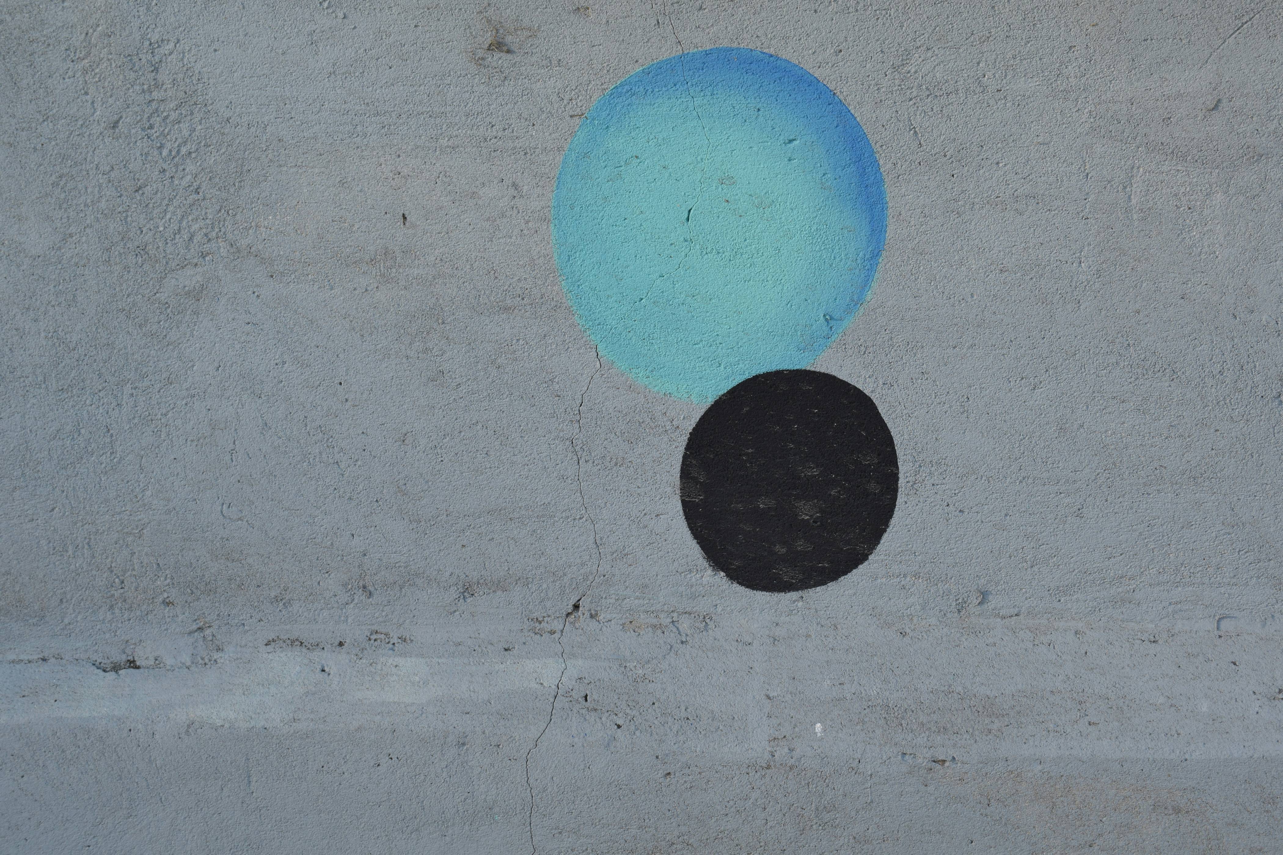 2 blue and black balloons