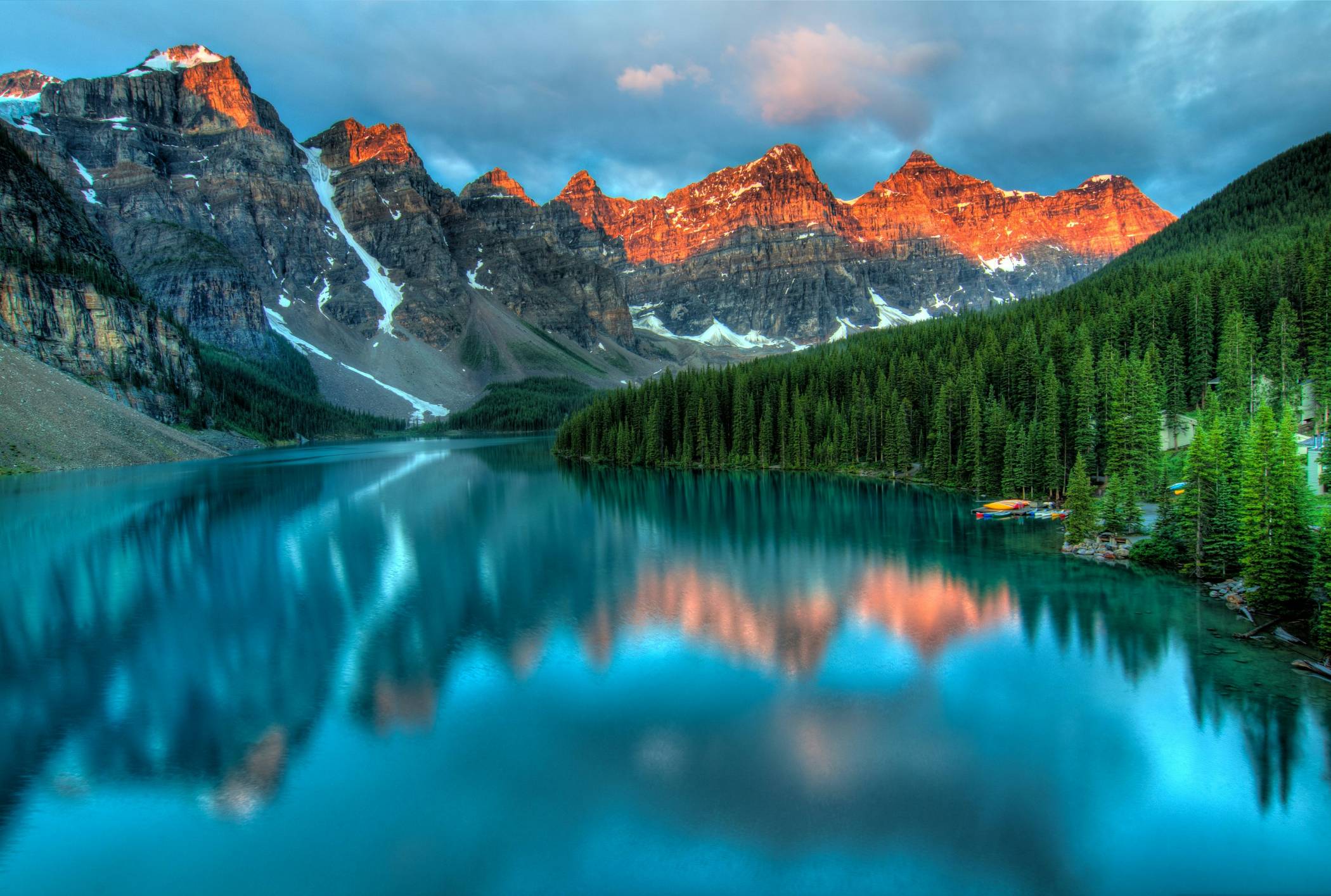 calm body of water and mountains wallpaper